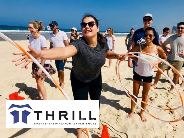 Be Game; Gold Coast beach activities throwing Hula Hoops and games for teams, staff and groups PLAY for purpose.